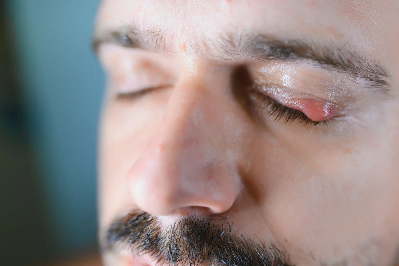 Detailed close-up of a human eye with shadow highlighting the textures and pupil.